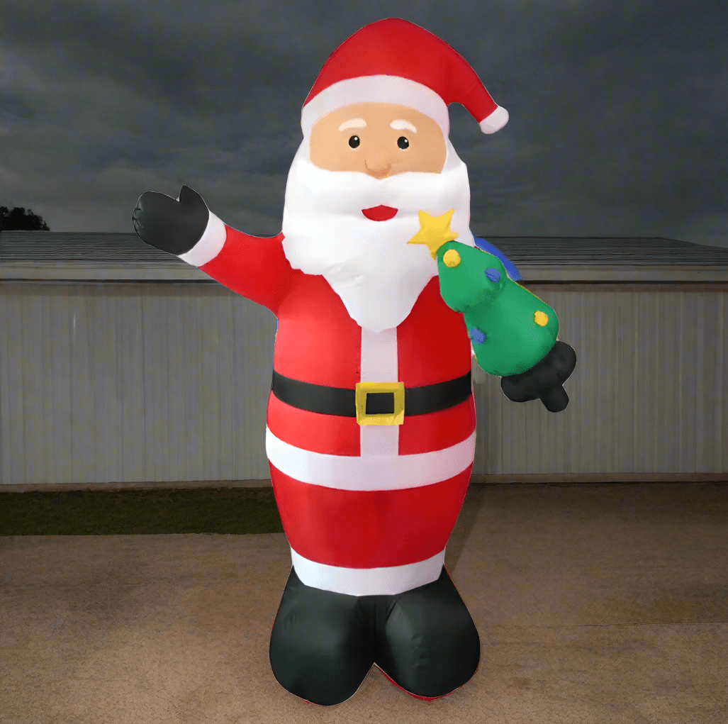 Inflatable Santa Claus figure holding a star and a green bag on a white background