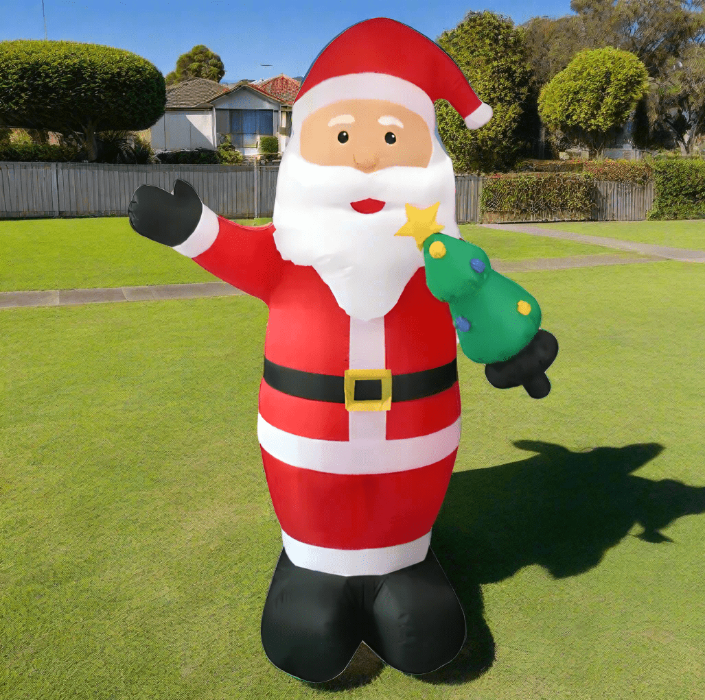 Inflatable Santa Claus figure holding a star and a green bag on a white background