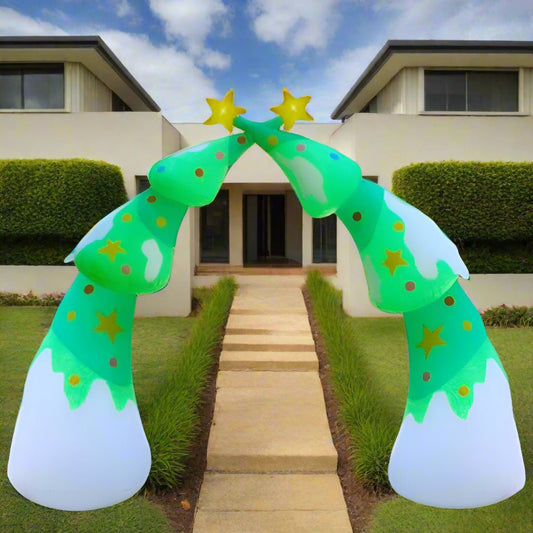 Inflatable Christmas archway decoration in front of a house with people walking towards it.