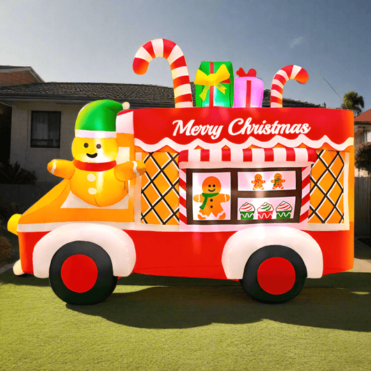 Toy truck with Christmas decorations and a gingerbread man figure on a white background