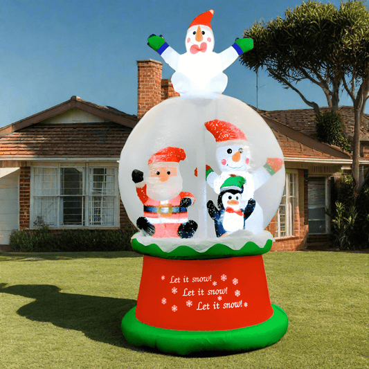 Inflatable snow globe with cartoon characters on a snowy outdoor setting