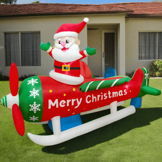 Inflatable Santa Claus on a Christmas airplane with a house in the background